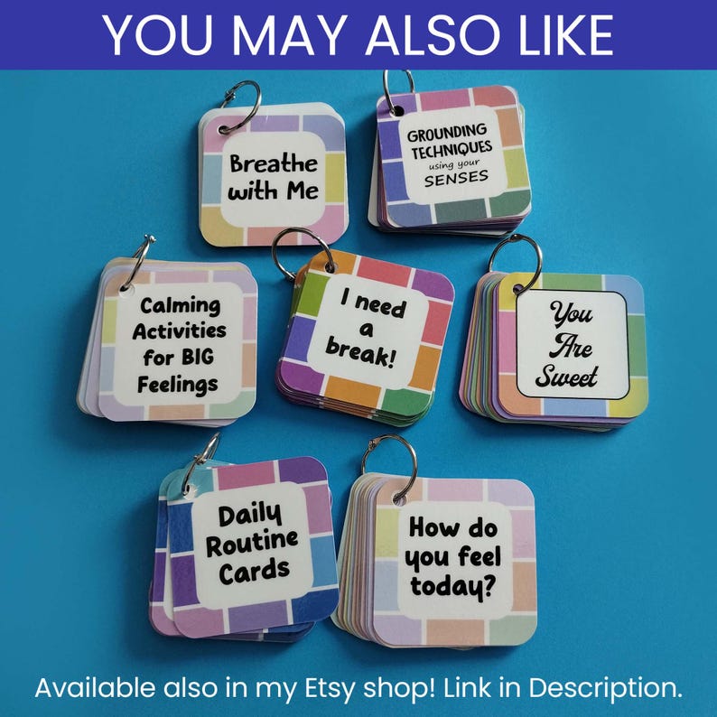 Puede incluir: Siete juegos de tarjetas cuadradas en anillos de metal, cada una con un centro blanco, texto negro y un borde de cuadr&iacute;cula colorido. El texto incluye Breathe with Me, Grounding Techniques, Calming Activities for BIG Feelings, I need a break, You Are Sweet, Daily Routine Cards y How do you feel today?