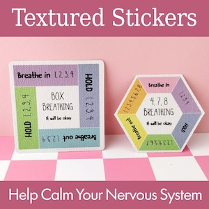 May include: Two textured stickers with breathing exercise instructions. One is square with "Box Breathing" instructions. The other is a hexagon with "4.7.8 Breathing" instructions. Both stickers have the phrase "It will be okay".