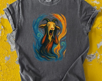 May include: A dark gray t-shirt with a colorful graphic print of a goat with a surprised expression. The goat is surrounded by swirling blue and orange paint.