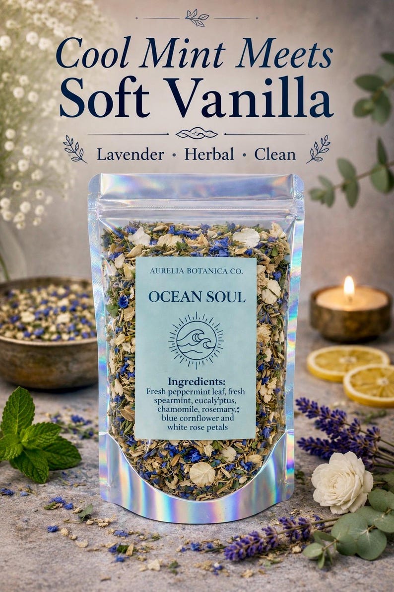 May include: A clear, holographic pouch filled with a dried herbal blend. The label reads Aurelia Botanica Co. Ocean Soul, listing ingredients: fresh peppermint leaf, fresh spearmint, eucalyptus, chamomile, rosemary, blue cornflower, and white rose petals.