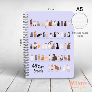 May include: A purple A5 notebook with a spiral binding. The cover features an illustration of 49 different cat breeds. The text "49 Cat Breeds" is printed on the cover. The notebook has 60 lined pages inside. The notebook measures 21 cm by 44 cm.