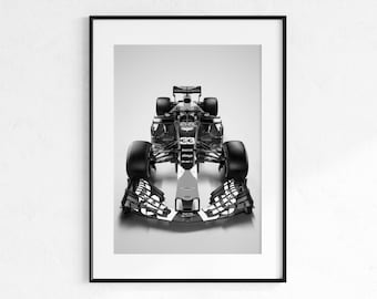 May include: Black and white framed print of a Formula 1 race car. The car is centered, showcasing its front profile with the number 33 visible. The image is a high-contrast, studio shot, emphasizing the car's design and details.