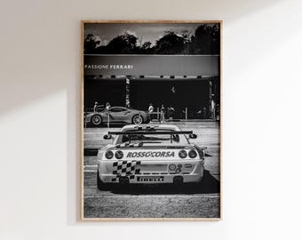 May include: Black and white framed print featuring a Ferrari race car with the text "ROSSO CORSA" and "PIRELLI". The print also shows a red Ferrari and the text "PASSIONE FERRARI".