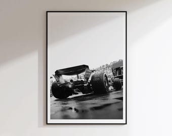 May include: A black and white framed wall art print featuring a rear view of a Formula One race car on a track. The image captures the large rear tyres, the aerodynamic rear wing, and the exhaust pipe of the vehicle in a high-contrast monochrome.
