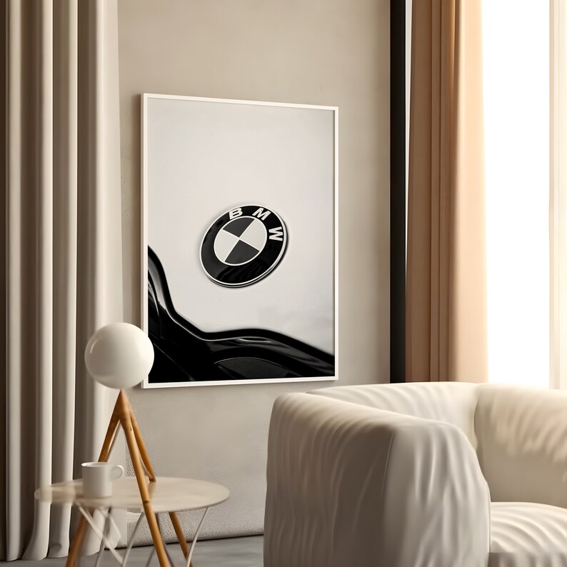 May include: Black and white framed print featuring a close-up of a BMW emblem. The emblem is circular with a black outer ring and a white and black center. The print is displayed in a modern living room setting.