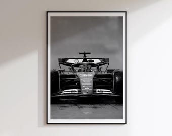 May include: A black and white framed wall art print featuring a front-facing view of a Formula 1 race car. The vehicle displays the HP logo on its rear wing and nose cone, with a sleek aerodynamic body, wide tires, and a central cockpit structure.