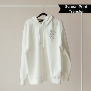 May include: White hooded sweatshirt with a black floral design on the left chest. The text "Screen Print Transfer" is visible in the top right corner of the image.