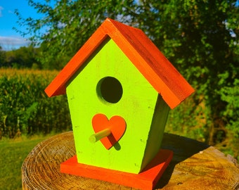 Handmade Cedar Birdhouse with colorful paint finish. Each birdhouse is made to your color specifications and comes with heart or flower.