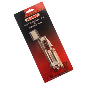 May include: A Janome Large Buttonhole Foot & Stabilizer Plate on a red and black card. The card has the text "9 mm Memory Craft 15000 only" and "www.sewingmachinesales.co.uk". The foot is clear plastic and metal.