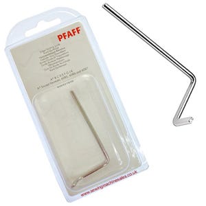 May include: A silver sewing machine edge/quilting guide, with a bent, L-shaped design. The guide is packaged in a clear plastic blister pack with the brand name "PFAFF" visible. The packaging includes text in multiple languages.