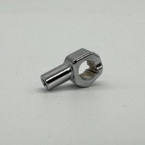 May include: A polished chrome sewing machine component. It features a hexagonal head with a circular aperture and a cylindrical projection. The text "sewingmachinesales.co.uk" is visible on the projection.