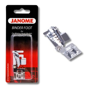 May include: A chrome Janome Binder Foot for oscillating hook models, presented on a black and red package. The package displays the Janome logo and product details. The foot is for sewing machines and has a maximum width of 5mm.