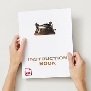 May include: A white cover for an instruction book for a vintage sewing machine. The cover has a picture of the sewing machine on the top and the words "INSTRUCTION BOOK" in brown text. A red PDF icon is in the bottom left corner.
