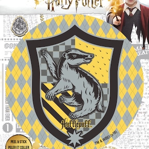 May include: A Hufflepuff crest sticker from the Harry Potter series. The sticker shows a grey badger on a yellow and black shield, set against a grey and yellow diamond pattern. The words "Hufflepuff" and "Harry Potter" are visible.