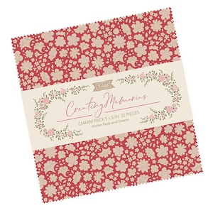 May include: A charm pack of fabric squares featuring a red and green floral pattern. The pack contains 32 squares, each measuring 5 inches by 5 inches. The fabric is designed by Tilda and is called "Creating Memories - Winter Reds and Greens".