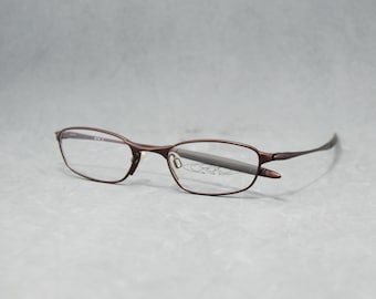 Gafas Oakley O2 11-614 Vintage. Japón, años 2000. Nuevas, usadas. Montura redondeada estrecha. Graduadas. Unisex. Diseño deportivo. Ajuste perfecto. Rojo burdeos.