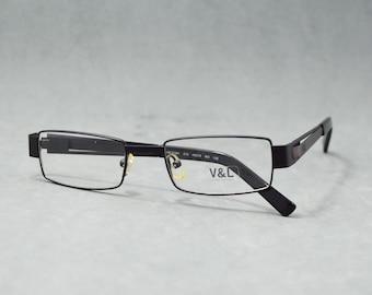 Victorio & Lucchino 57281 215. Óculos de grau vintage. Optim Espanha, década de 2010. Novos, nunca usados. Unissex. Cor preta. Tamanho 49 18 140.