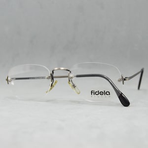 Lunettes de vue vintage sans monture FIDELA France années 80 et 90, lunettes de soleil Rx classiques polygonales unisexes jamais portées pour homme et femme. Grande taille. Bronze vieilli noir.
