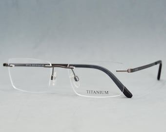 Hochwertige, randlose Premium-Brille. Gestell aus reinem Titan. Neue, ausgewählte Brillenmodelle. Unisex-Brille. Rechteckig. Ruthenium. Klassisches Design.