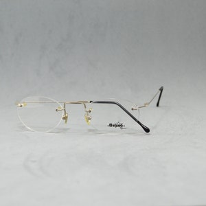 Vintage Rimless EyeGlasses STING NOS Unworn Classic round Unisex man Woman Rx eyewear 90s 00s Silver Black Flexible Stainless steal