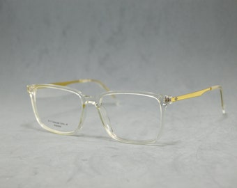 Eyeglasses Eyewear acetate and top japanese beta titanium. Rx lenses incluide in price.Elegant Unisex. square shape.  Crystal clear golden