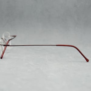 Rimless EyeGlasses TITANIUM 505 07. Dead Stock. Nos Unworn. Unisex Woman. 00s. Garnet. Small cateye. Regular size. 50 18 140 Spec Eyewear image 6
