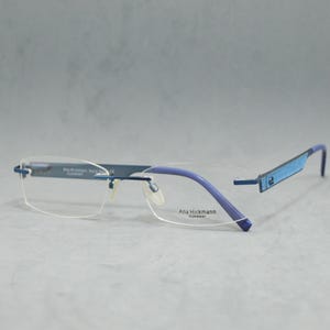 Lunettes de vue sans monture de la marque Ana Hickman. Animaux morts. NSA. Lunettes de vue classiques carrées étroites unisexe homme femme Acier inoxydable bleu électrique