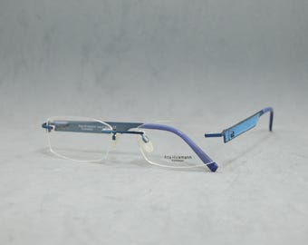 Rimless Eyeglasses Brand Ana Hickman. Dead Stock. NOS. Classic square narrow Unisex man Woman eyewear  Stainless steel electric blue