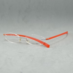 Vintage Rimless EyeGlasses Wagner & Kühner Germany NOS. Unisex Reading glasses. Rx lenses incluided.   Hexagonal 00s Silver Orange Arms tr90