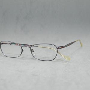 Christian LACROIX France 5039 Vintage metal woman Eyeglasses NOS unworn. Classic half oval small cateye eyewear Light blue colorful temples