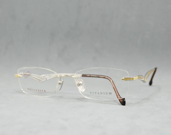 Gafas de sol vintage sin montura de titanio STEPPER EX-50311 FX021. NOS. Sin usar. Unisex. Mujer. Hombre. Años 00. Rectangular. Gafas de sol. Plateadas, doradas.