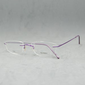 Top Titanium Vintage Rimless EyeGlasses VISTAN Germany NOS Unworn elegant Woman 00Ss Fantasy shape small butterfly electric violet Eyewear