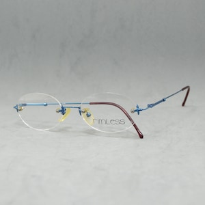 Lunettes sans monture vintage Rimless Allemagne NOS. Lunettes Rx unisexe homme Femme. Acier inoxydable ovale classique arrondi 90S bleu électrique marron