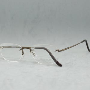 Lunettes de vue vintage sans monture ARISTAR by Charmant 6133 NOS carrées unisexe homme femme lunettes Rx OOs acier inoxydable chirurgical marron argent