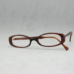 00s Vintage acetate eyeglasses Donna Karan New York DKNY 6817 201 Italy NOS Unworn small catete woman oval shinny light brown mod design