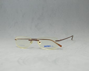 Top Vintage titanium Rimless EyeGlasses LUXOTTICA Nos Unworn.  Unisex .Man Woman. Reading Glasses. Rx lenses incluided. Top Eyewear