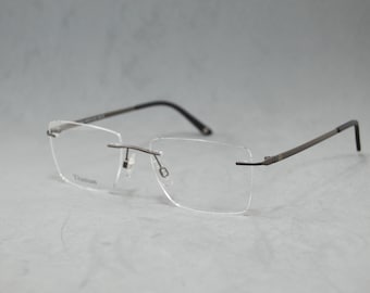 Gafas sin montura de alta calidad. Montura de titanio puro con identificación. Nuevas gafas premium seleccionadas. Gafas unisex. Rectangulares. Color bronce. Moda clásica.
