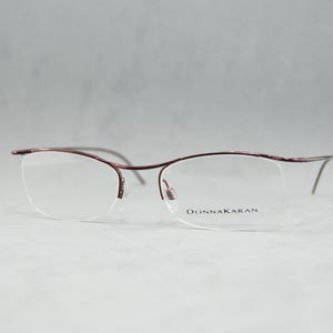 00s Vintage half rimless eyeglasses Donna Karan 8247 604 50 Italy NOS Unworn Classic Small Oval unisex man woman garnet. Incluided rx lenses