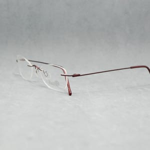 Rimless EyeGlasses TITANIUM 505 07. Dead Stock. Nos Unworn. Unisex Woman. 00s. Garnet. Small cateye. Regular size. 50 18 140 Spec Eyewear image 5