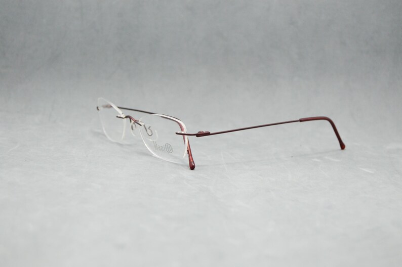 Rimless EyeGlasses TITANIUM 505 07. Dead Stock. Nos Unworn. Unisex Woman. 00s. Garnet. Small cateye. Regular size. 50 18 140 Spec Eyewear image 5