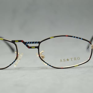 Vintage metal Eyeglasses ASTRO Line ELITE 5052 Italy fantasy narrow shape polygonal unisex man woman Main color golden and black Colorful