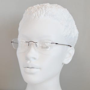 Rimless EyeGlasses TITANIUM 505 07. Dead Stock. Nos Unworn. Unisex Woman. 00s. Garnet. Small cateye. Regular size. 50 18 140 Spec Eyewear image 1