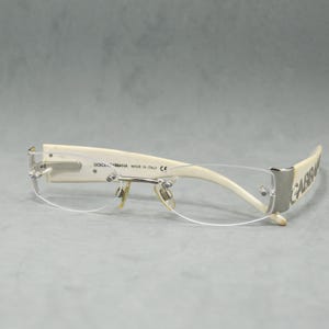 Lunettes de vue vintage sans monture DOLCE GABBANA 1102 classiques ovales à chaîne étroite Caractéristiques techniques Mode diva femme Argenté acétate crème marbré