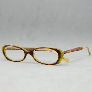 00s Vintage acetate eyeglasses Donna Karan New York DKNY 6806 315 Italy NOS Unworn small catete woman oval green classic carey mod design