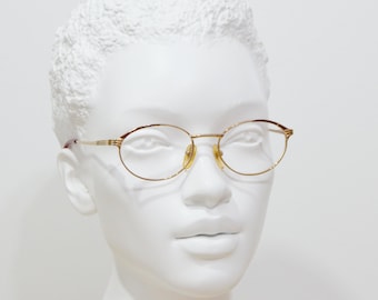 Vintage Damenbrille aus Metall von XAFFER, ungetragen. Klassische ovale, abgerundete, marmorierte braun-goldene Korrektionsbrille aus den 90er Jahren, NOS (New Old Stock).