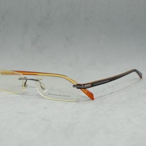 Lunettes de vue Donna Karan 3555 vintage sans monture en acétate Italie NSA jamais portées Classique carrée rectangulaire unisexe homme femme années 2000 bronze noir orange