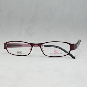 Vintage Eyeglasses COLLECTION CREATIVE 1212 990 Germany. Narrow oval woman reading eyewear Incluided RX lenses. Garnet violet and black. 00s