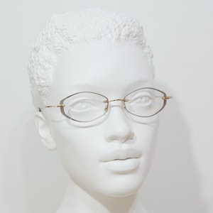 L'ART by AMA Top vintage fantasy lunettes sans monture Allemagne NSA, jamais portées pour femme élégante des années 90 hexagonale, or, marron. Acier inoxydable souple