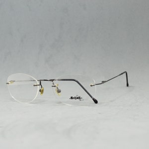 Vintage Rimless EyeGlasses STING NOS Unworn Classic Oval rounded round Unisex man Woman Rx eyewear 90s 00s Black Flexible Stainless steal