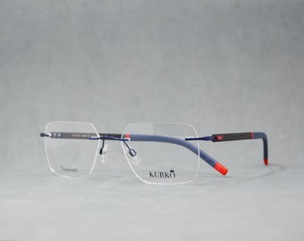 Gafas sin montura de alta gama. Montura de titanio puro con identificación. Fibra de carbono. Nuevas gafas premium seleccionadas. Gafas para hombre. Deportivas. Rectangulares. Azul Francia y rojo.